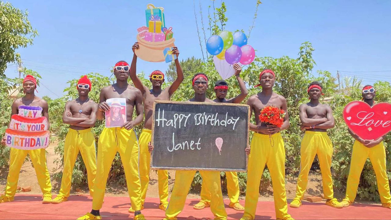 Wife crying happy tears while watching personalized Africa video greeting with dancers and her name on screen